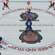 Some ice hockey, at the centre of the rink, in Tape To Tape.